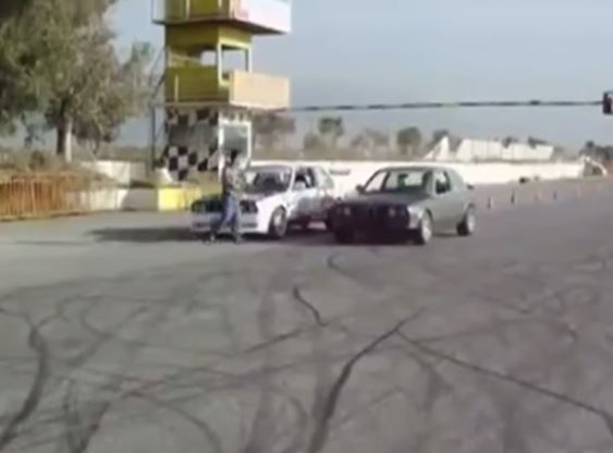 Two BMWs drifting